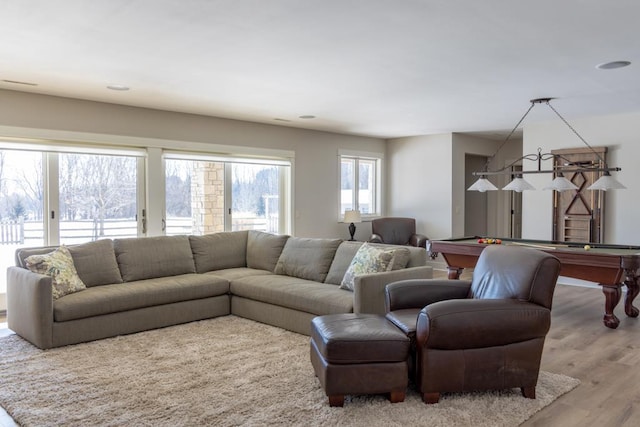 living room featuring light wood-style floors, billiards, and visible vents