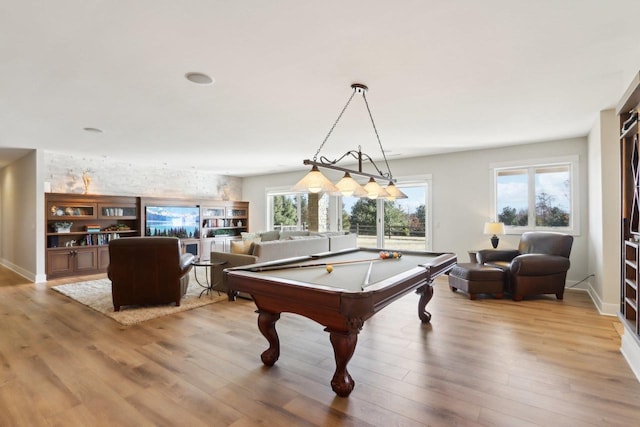 rec room with billiards, baseboards, and wood finished floors