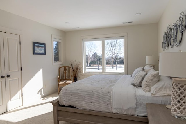 bedroom with carpet and visible vents