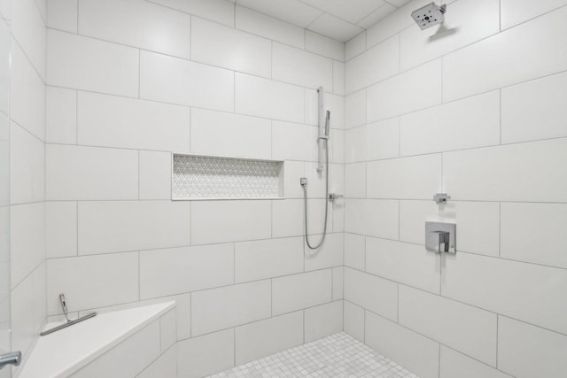 full bath with a tile shower