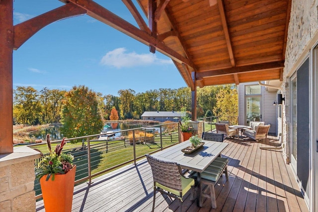 wooden deck featuring a water view and outdoor lounge area