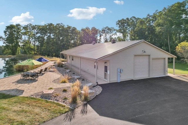 detached garage with a water view