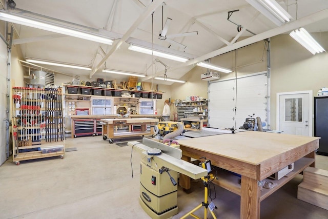 garage with a wall mounted AC and a workshop area