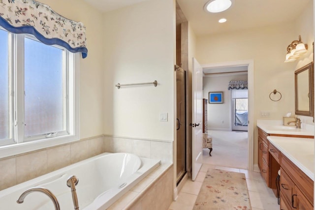 full bathroom with recessed lighting, tile patterned floors, a stall shower, vanity, and a bath