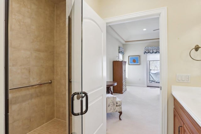 ensuite bathroom with a stall shower, vanity, and ensuite bathroom