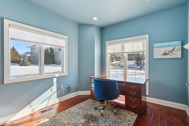 office space with baseboards, visible vents, dark wood-type flooring, and recessed lighting