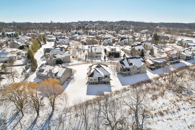 snowy aerial view featuring a residential view