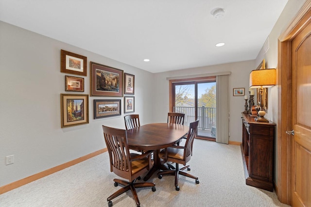 dining space with recessed lighting, baseboards, and light colored carpet