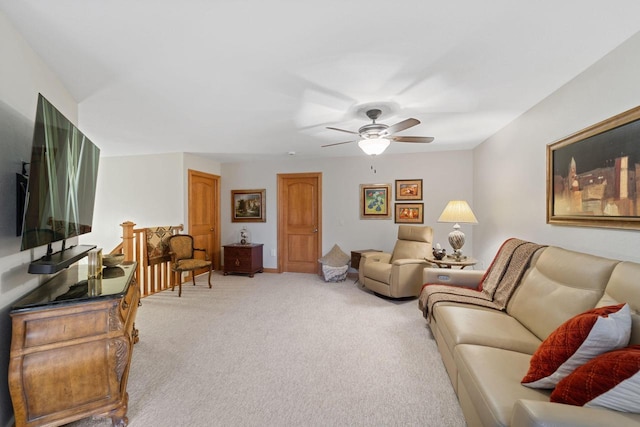 living room featuring light carpet and ceiling fan