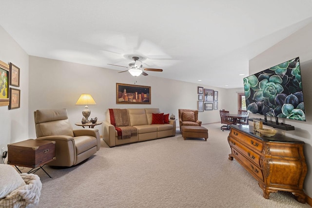 living room with light carpet, ceiling fan, and recessed lighting