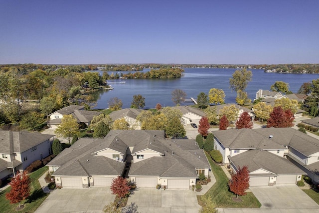 bird's eye view with a water view and a residential view