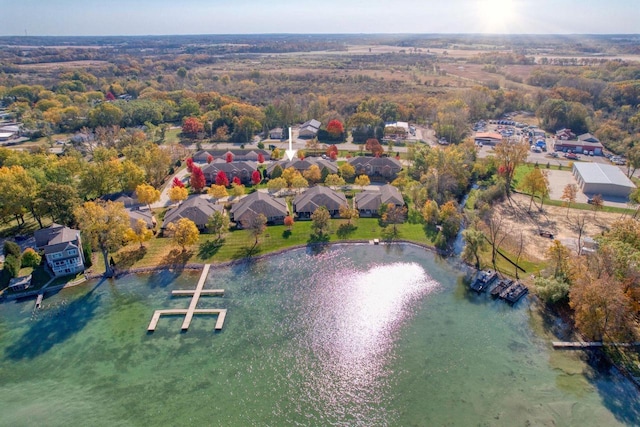 drone / aerial view with a water view and a residential view