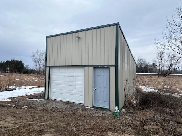 view of snow covered garage