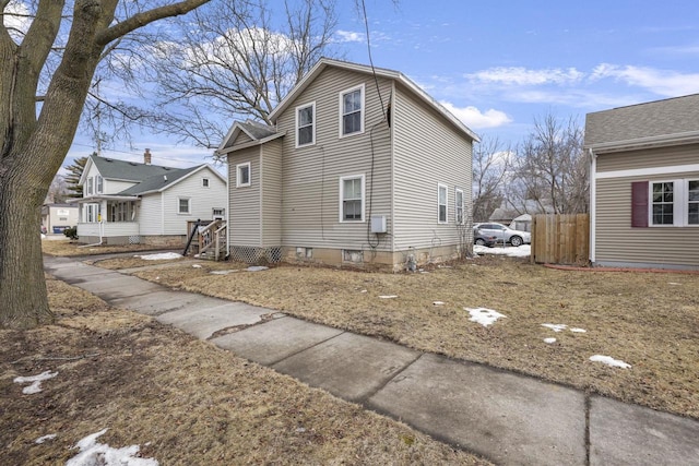 view of property exterior with fence