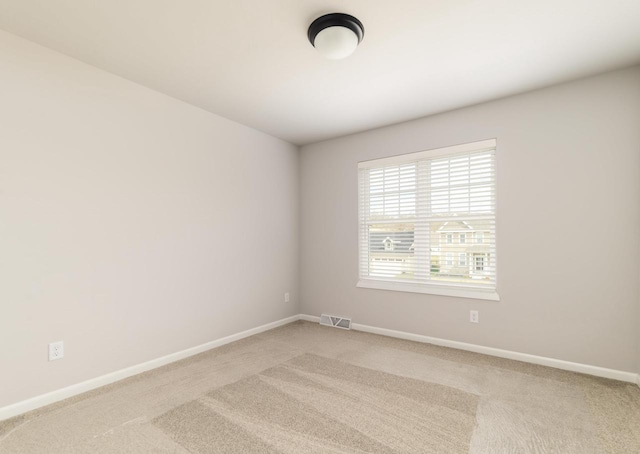 8012 Laufenberg Blvd, Cross Plains, WI 53528 - empty room with visible vents, baseboards, and light carpet