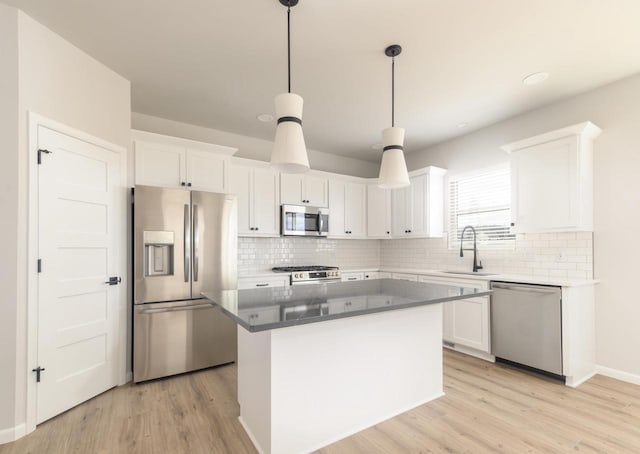 8012 Laufenberg Blvd, Cross Plains, WI 53528 - kitchen with backsplash, white cabinetry, stainless steel appliances, and a sink