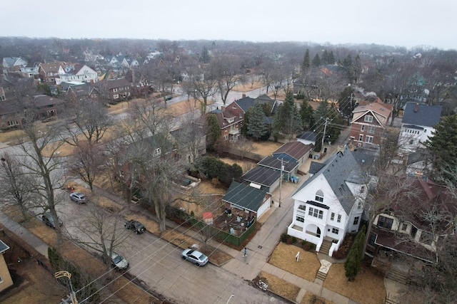 birds eye view of property with a residential view