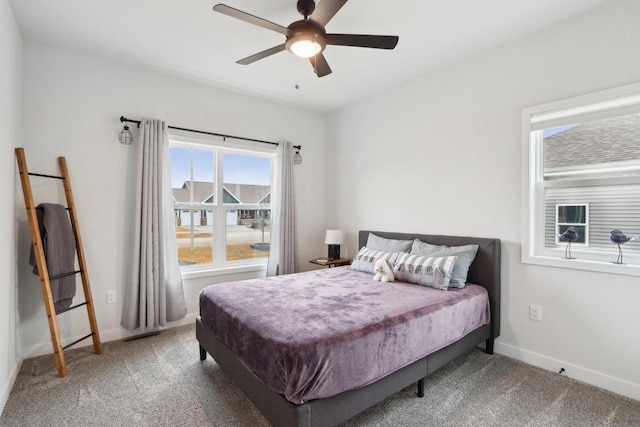 bedroom with carpet, ceiling fan, and baseboards