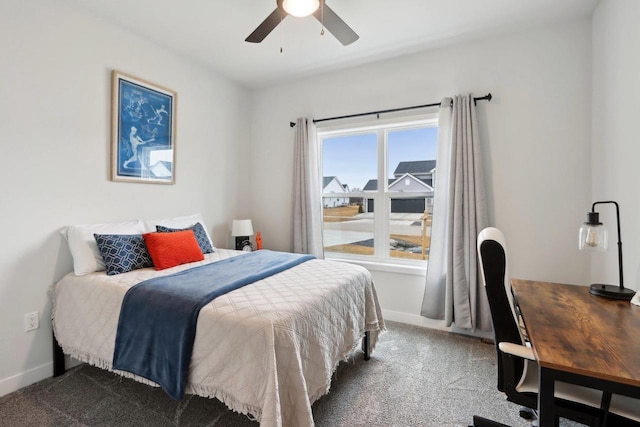 bedroom featuring a ceiling fan, carpet, and baseboards