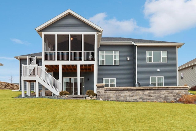 rear view of property featuring a yard, stairway, and a sunroom