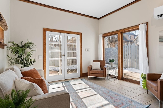 living area with french doors, light tile patterned flooring, crown molding, and an AC wall unit