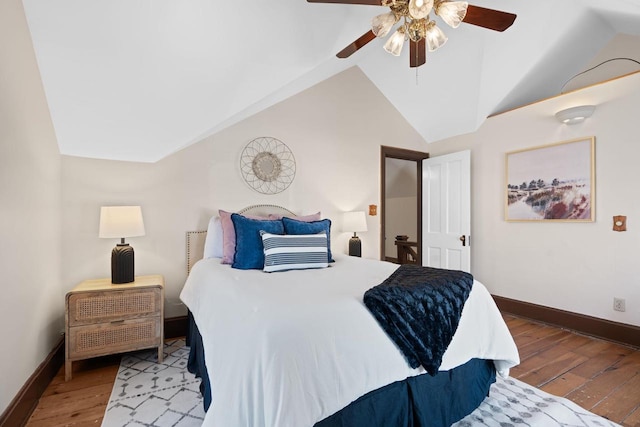 bedroom with a ceiling fan, light wood-type flooring, vaulted ceiling, and baseboards