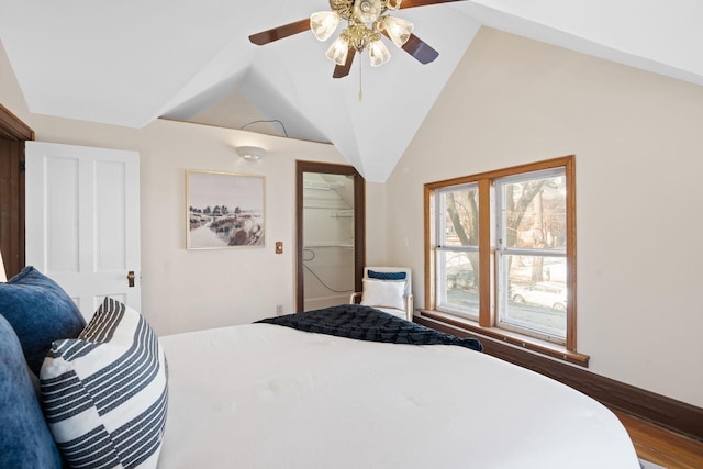 bedroom featuring lofted ceiling and a ceiling fan