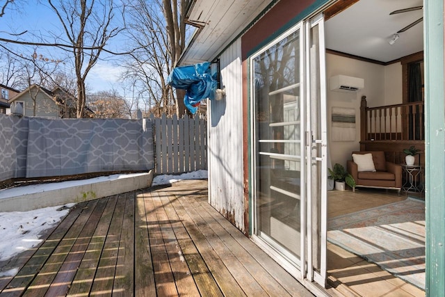 deck featuring fence and a wall mounted air conditioner