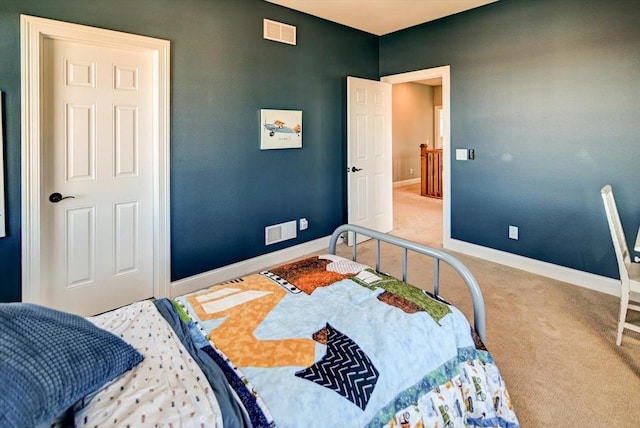 bedroom featuring carpet floors, visible vents, and baseboards