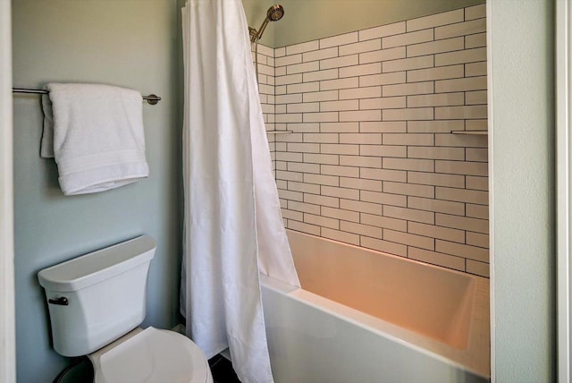 full bath featuring shower / bath combo and toilet