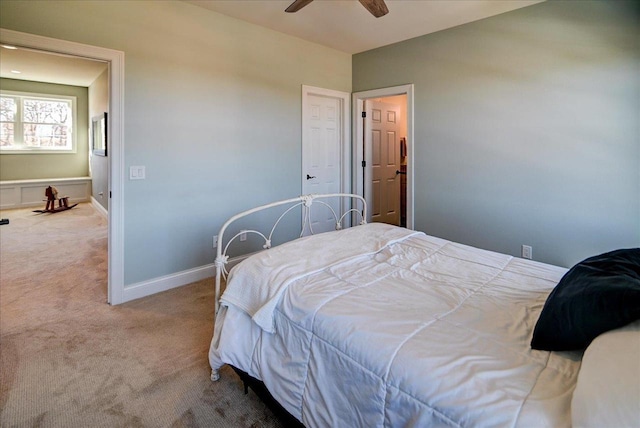 bedroom with light carpet, a ceiling fan, and baseboards