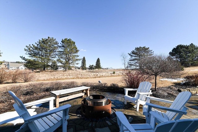 view of patio / terrace featuring an outdoor fire pit