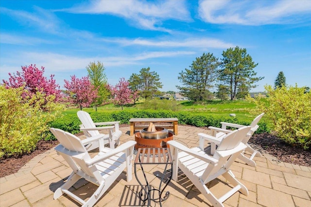 view of patio featuring an outdoor fire pit