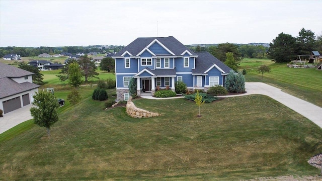 view of front facade featuring covered porch and concrete driveway