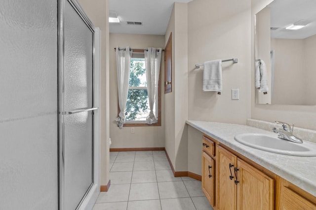 bathroom with visible vents, toilet, tile patterned flooring, vanity, and a shower stall