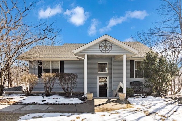 view of front of property with a shingled roof