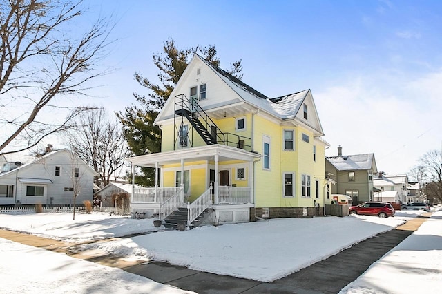 view of front of property with a residential view and covered porch