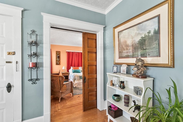 355 W Mill St, Columbus, WI 53925 - corridor with a textured ceiling, ornamental molding, and wood finished floors