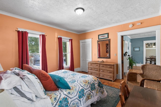 355 W Mill St, Columbus, WI 53925 - bedroom with crown molding, wood finished floors, and a textured ceiling