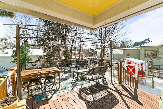 355 W Mill St, Columbus, WI 53925 - snow covered deck with outdoor dining space, an outdoor living space, and a shed