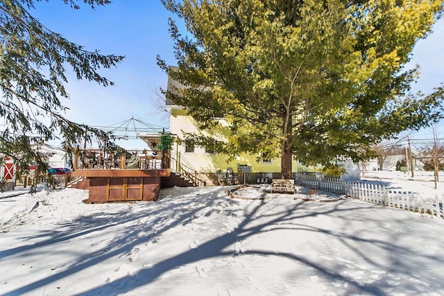 355 W Mill St, Columbus, WI 53925 - snowy yard with a wooden deck and stairs