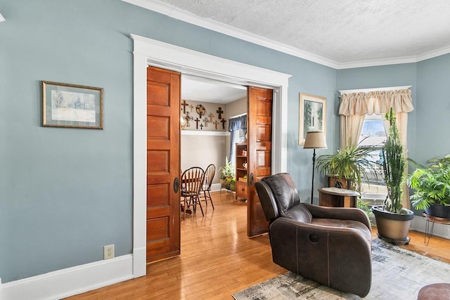 355 W Mill St, Columbus, WI 53925 - sitting room with wood finished floors, crown molding, and a textured ceiling