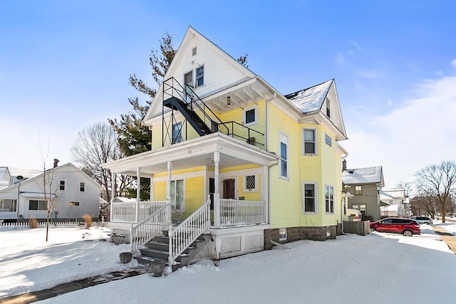 355 W Mill St, Columbus, WI 53925 - view of front of home featuring covered porch and a balcony