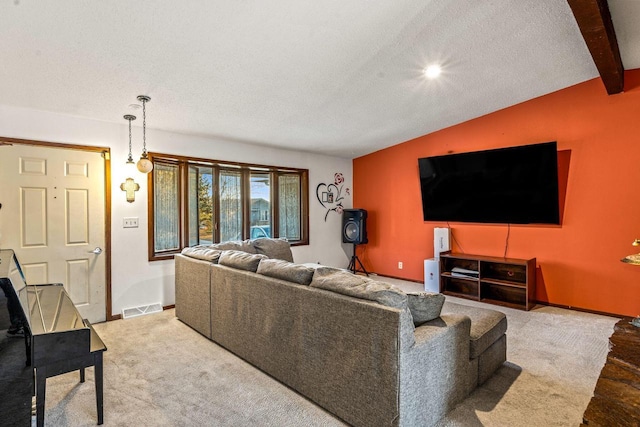 living area with lofted ceiling with beams, a textured ceiling, visible vents, and baseboards