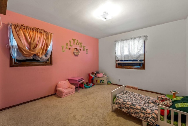 bedroom with carpet, visible vents, and baseboards