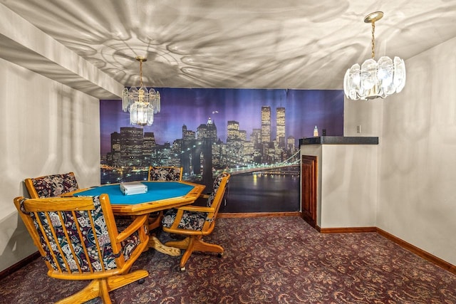 dining space featuring an inviting chandelier and baseboards