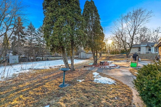 yard covered in snow with fence