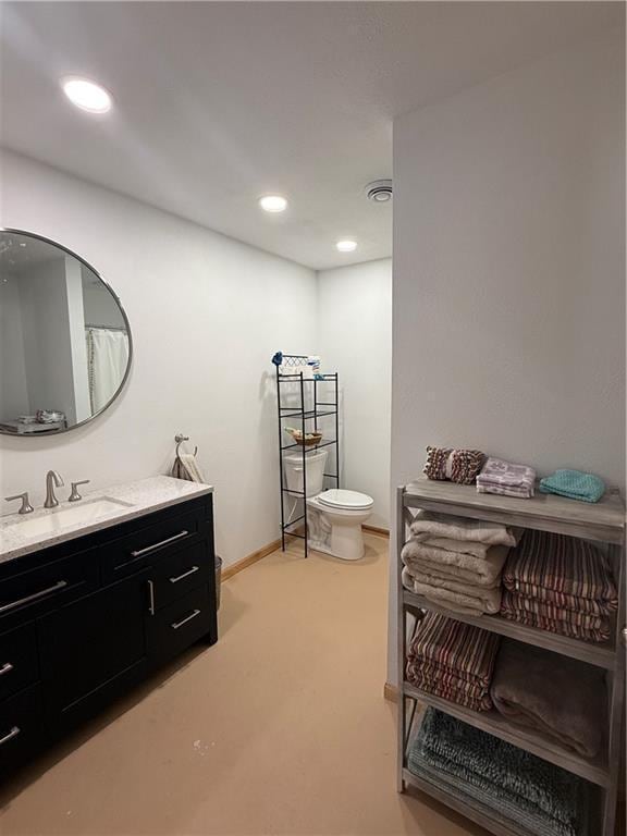 full bath with recessed lighting, toilet, vanity, and baseboards