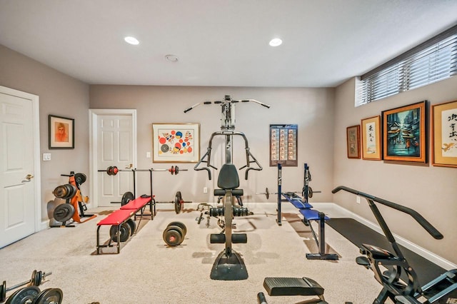 workout area featuring carpet flooring, recessed lighting, and baseboards