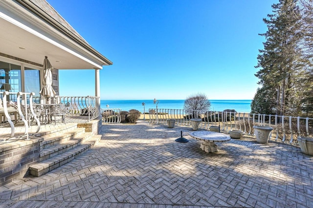 view of patio / terrace featuring a water view